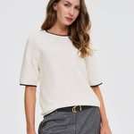 White jumper with piping