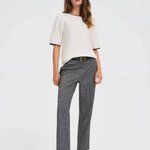 White jumper with piping