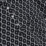 White and black blouse with a geometric pattern