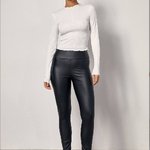 Black leggings made of eco-leather are insulated