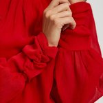 Red blouse with a rose