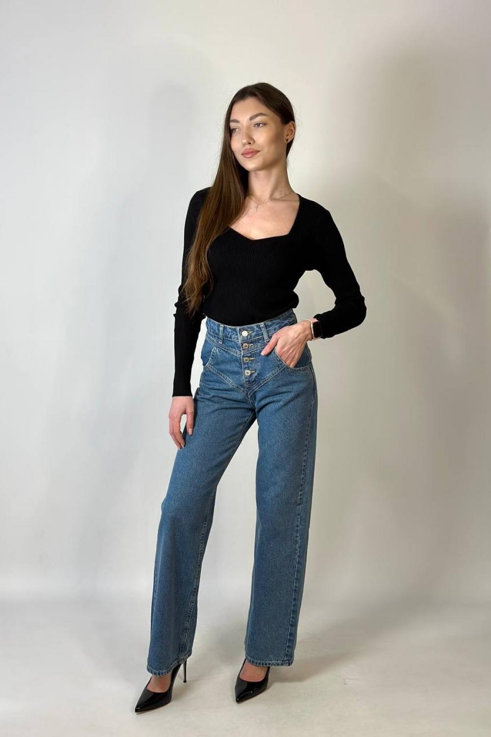Women's jeans are straight with a curly coquette of blue color