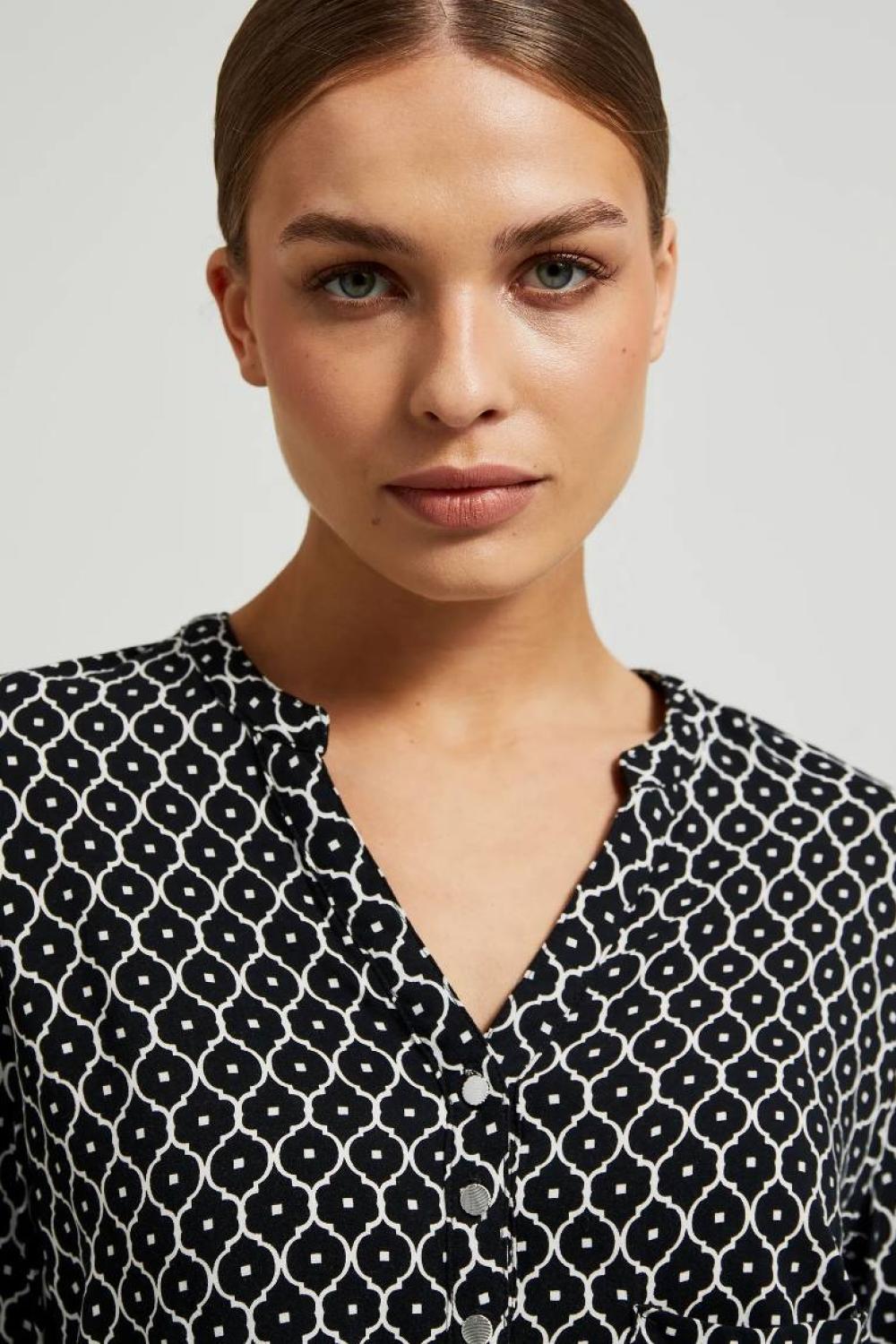 White and black blouse with a geometric pattern