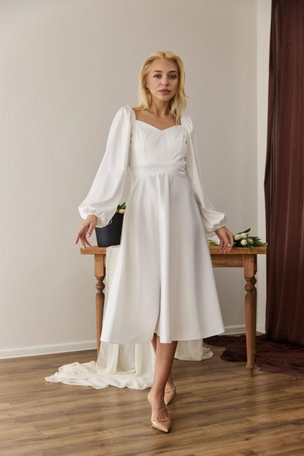 White midi length dress for a formal occasion
