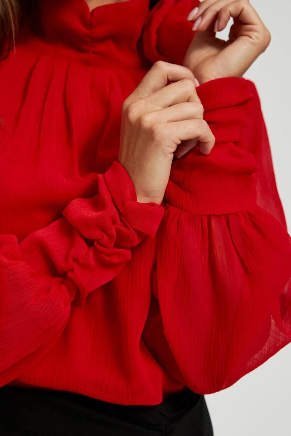 Red blouse with a rose