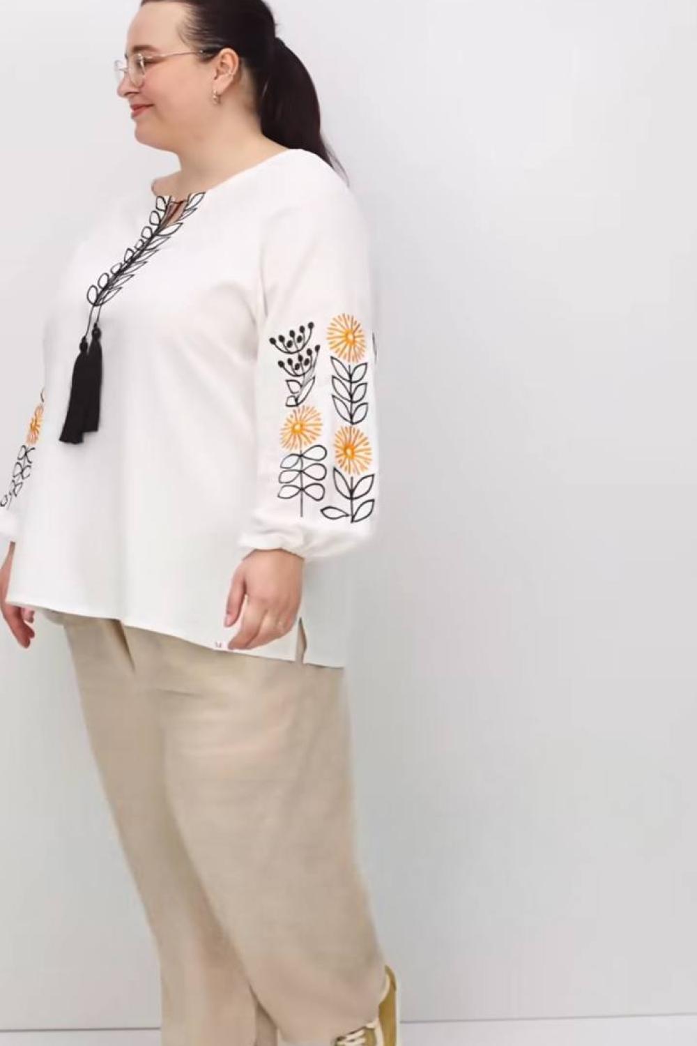 Embroidered sunflowers in white color