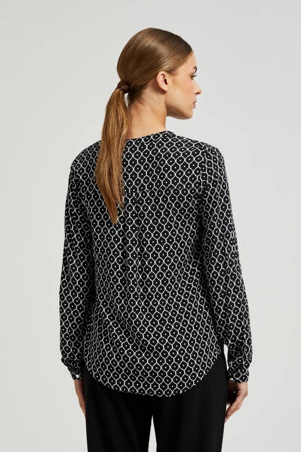 White and black blouse with a geometric pattern