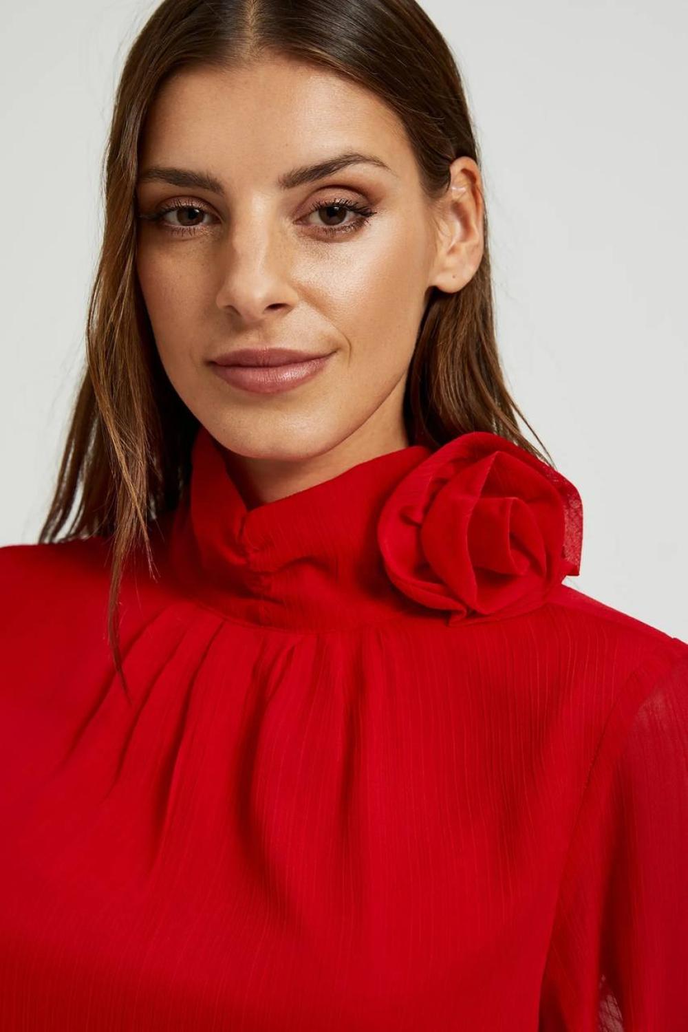 Red blouse with a rose