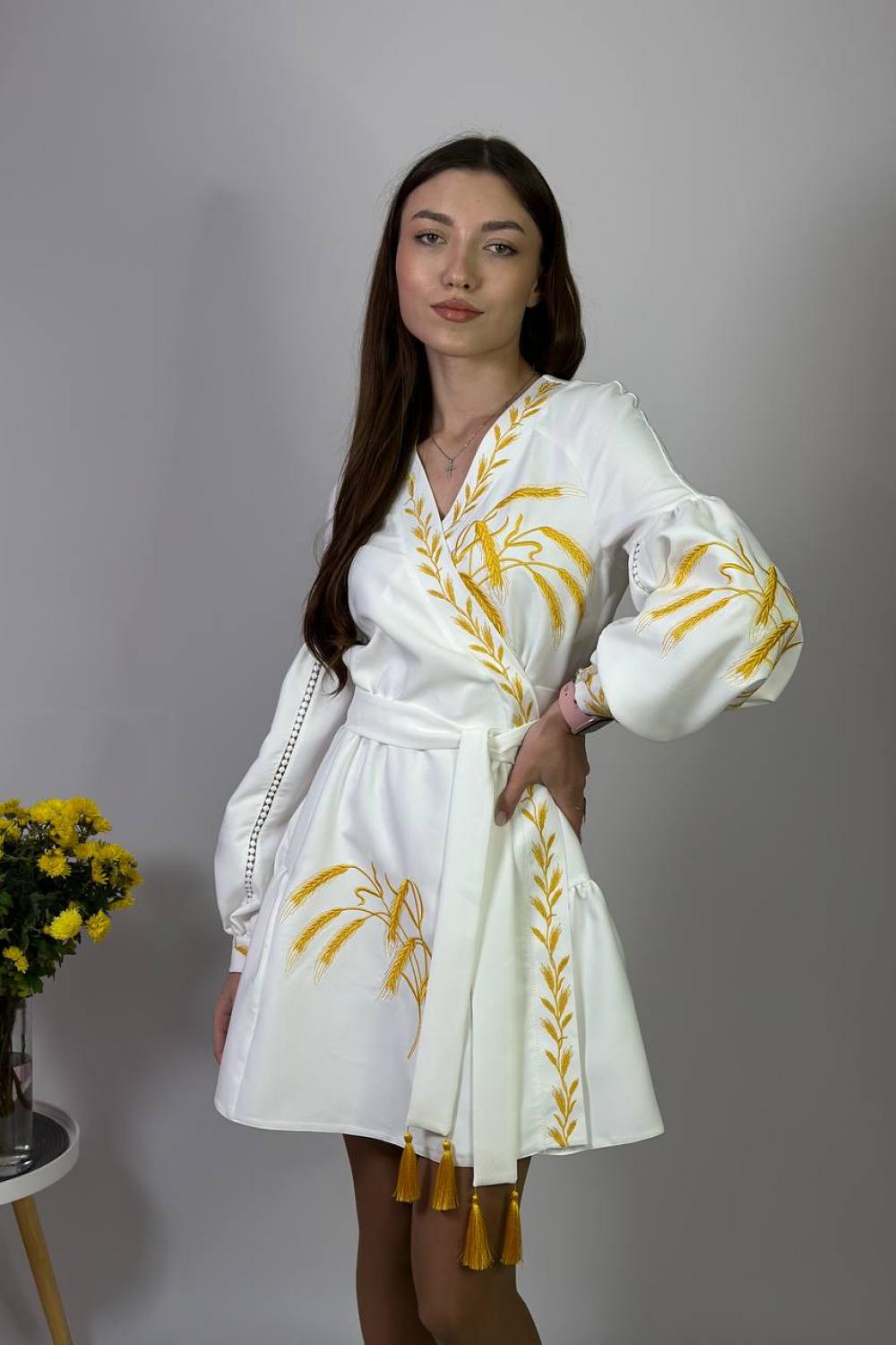 Women's white embroidered dress with gold embroidered spikes