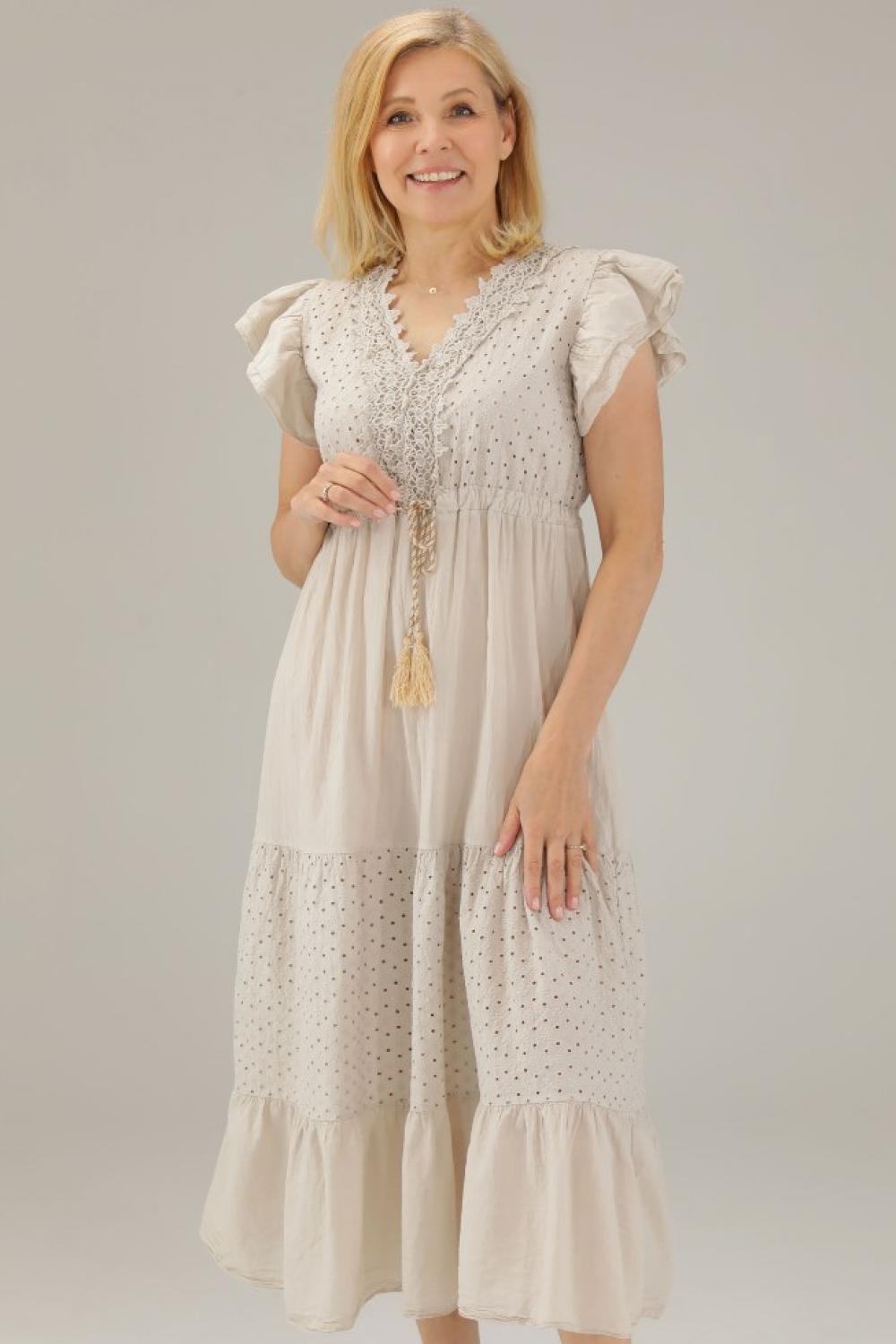 The beige dress is made of thread 225-22118