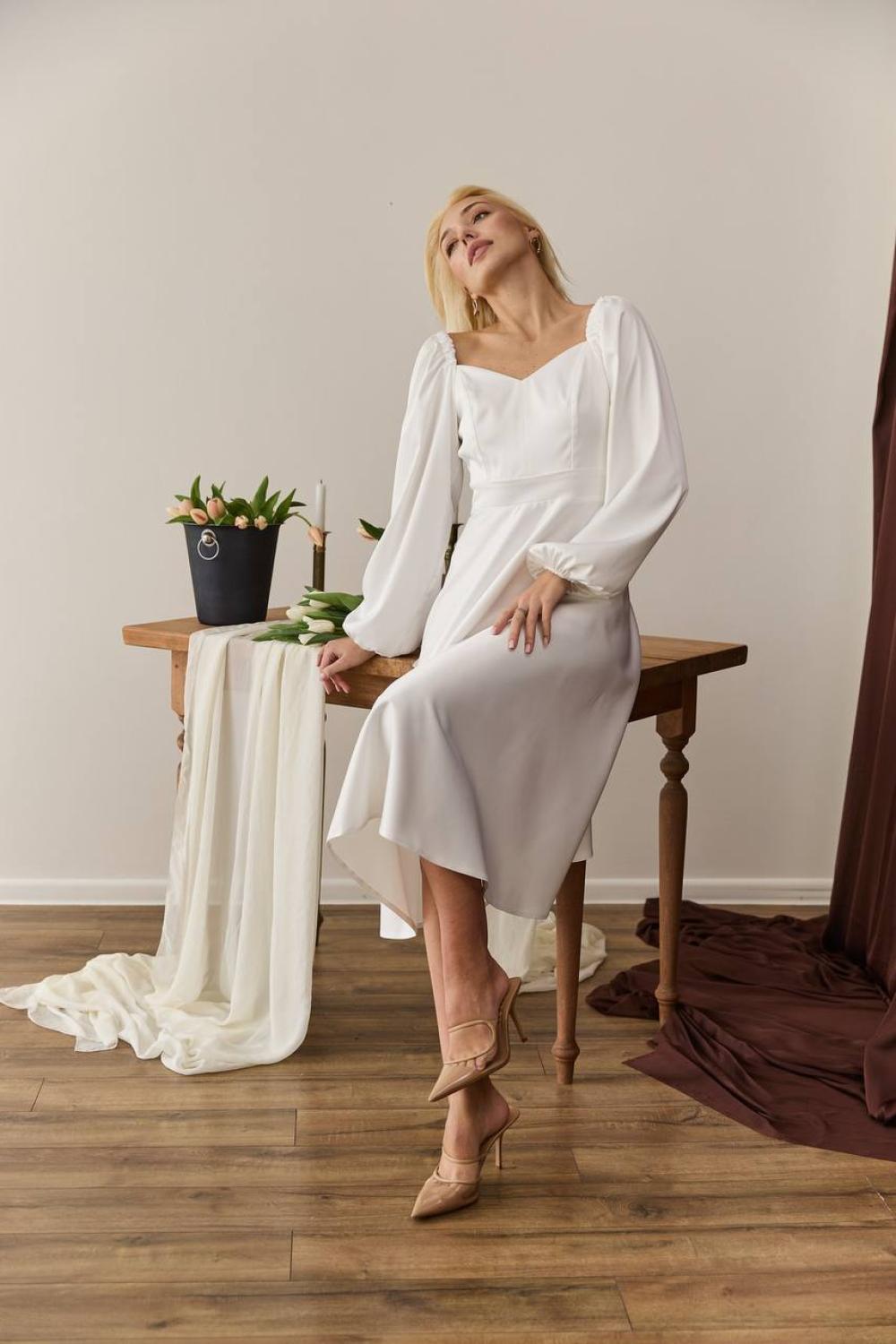 White midi length dress for a formal occasion