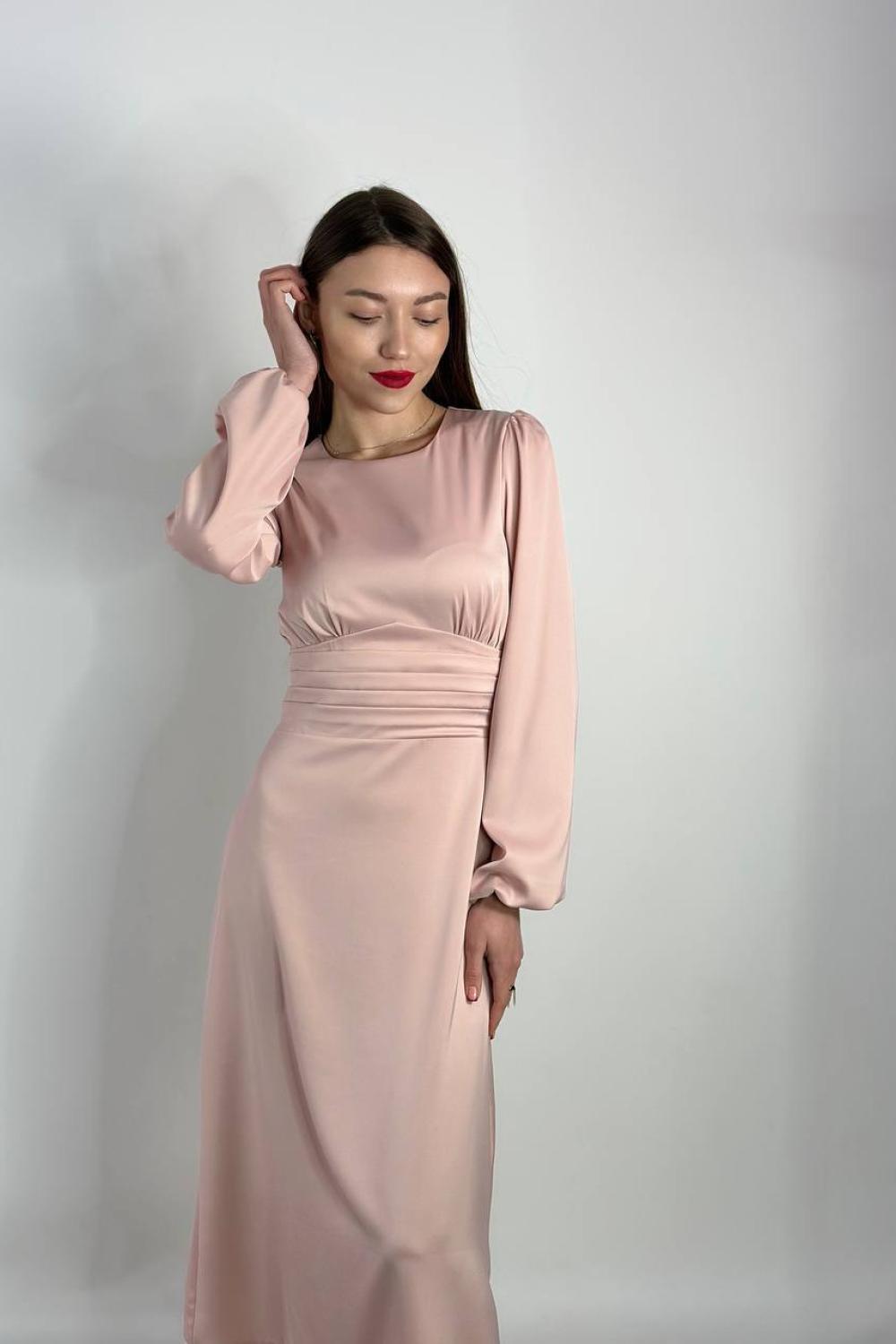Elegant powder-colored midi-length dress.