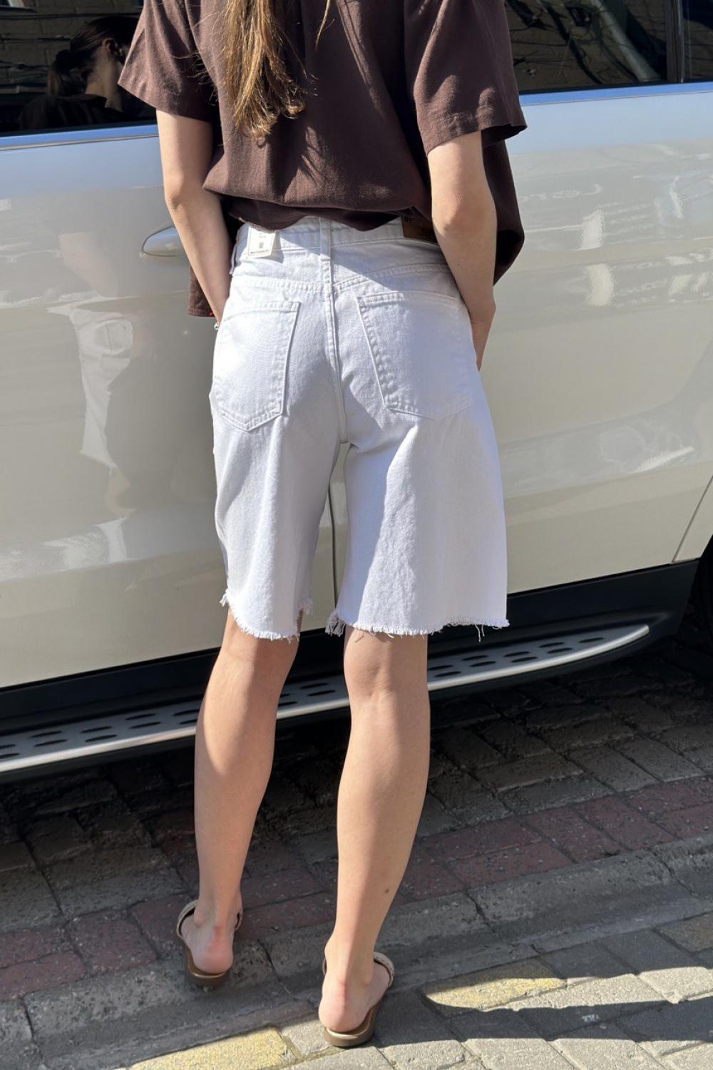 It's basic white elongated denim shorts