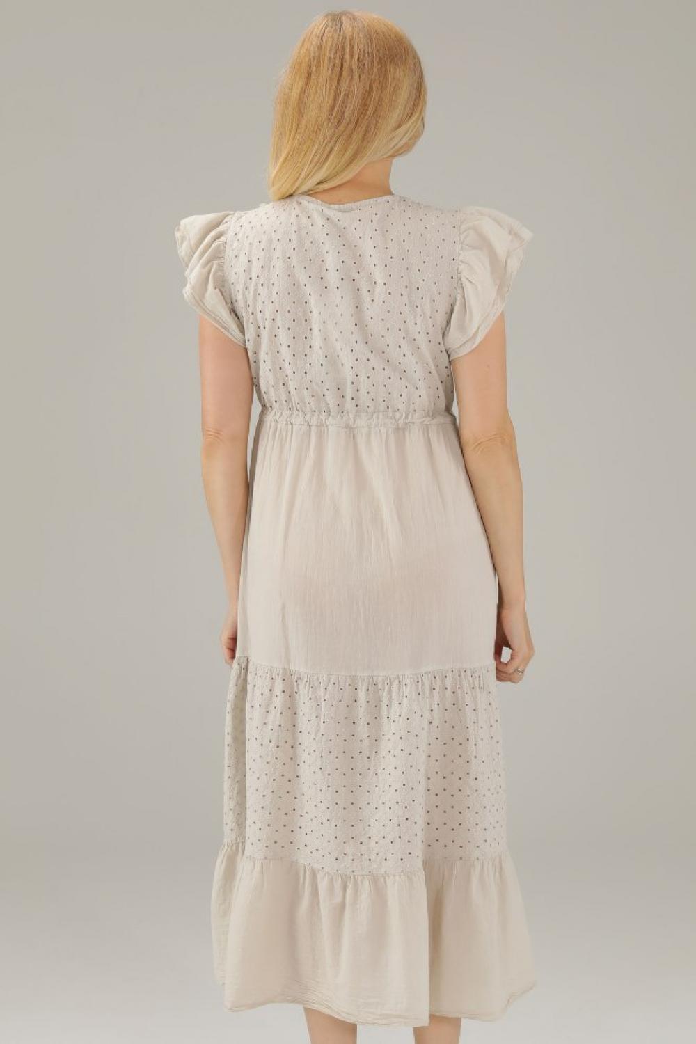 The beige dress is made of thread 225-22118