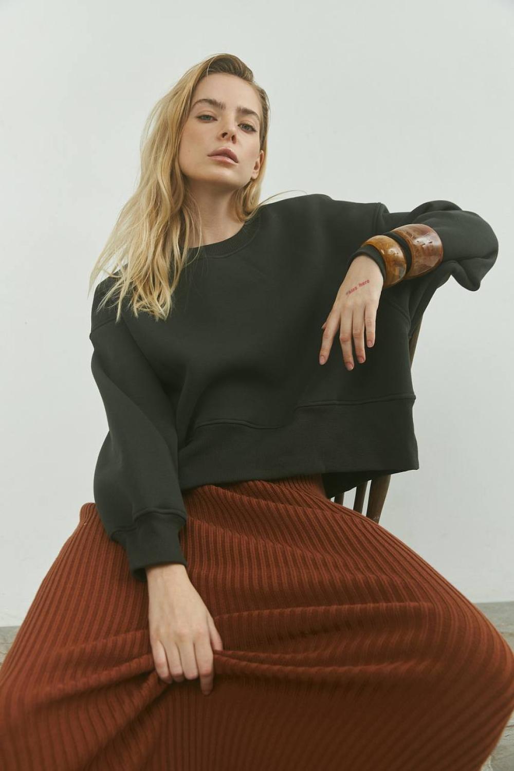 Grey women's sweatshirt on a bike