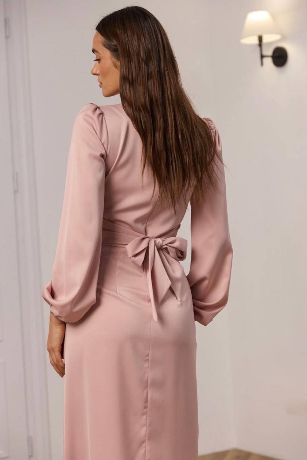 Elegant powder-colored midi-length dress.
