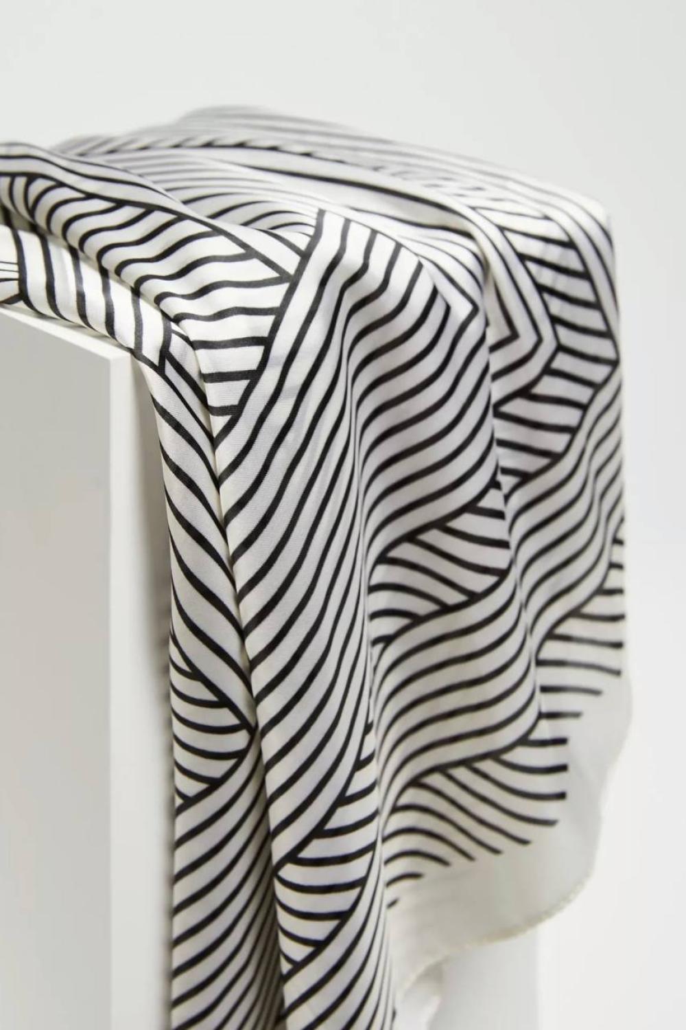 A beige and black silk scarf MOODO
