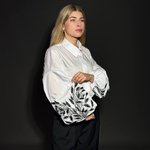 A classic white blouse with embroidered ears of corn