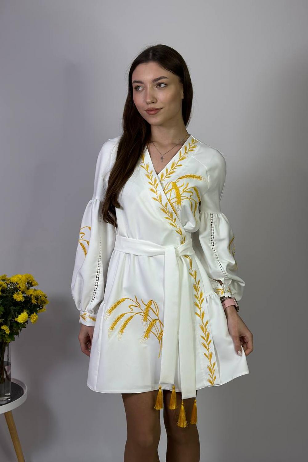 Women's white embroidered dress with gold embroidered spikes