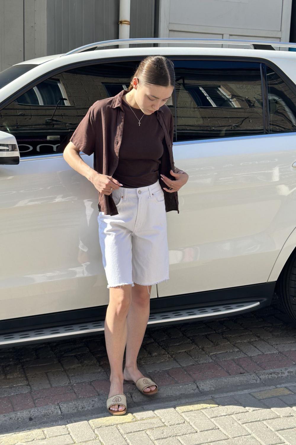 It's basic white elongated denim shorts