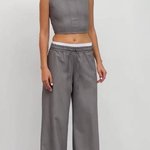 Gray trousers with an elastic waistband with a double belt