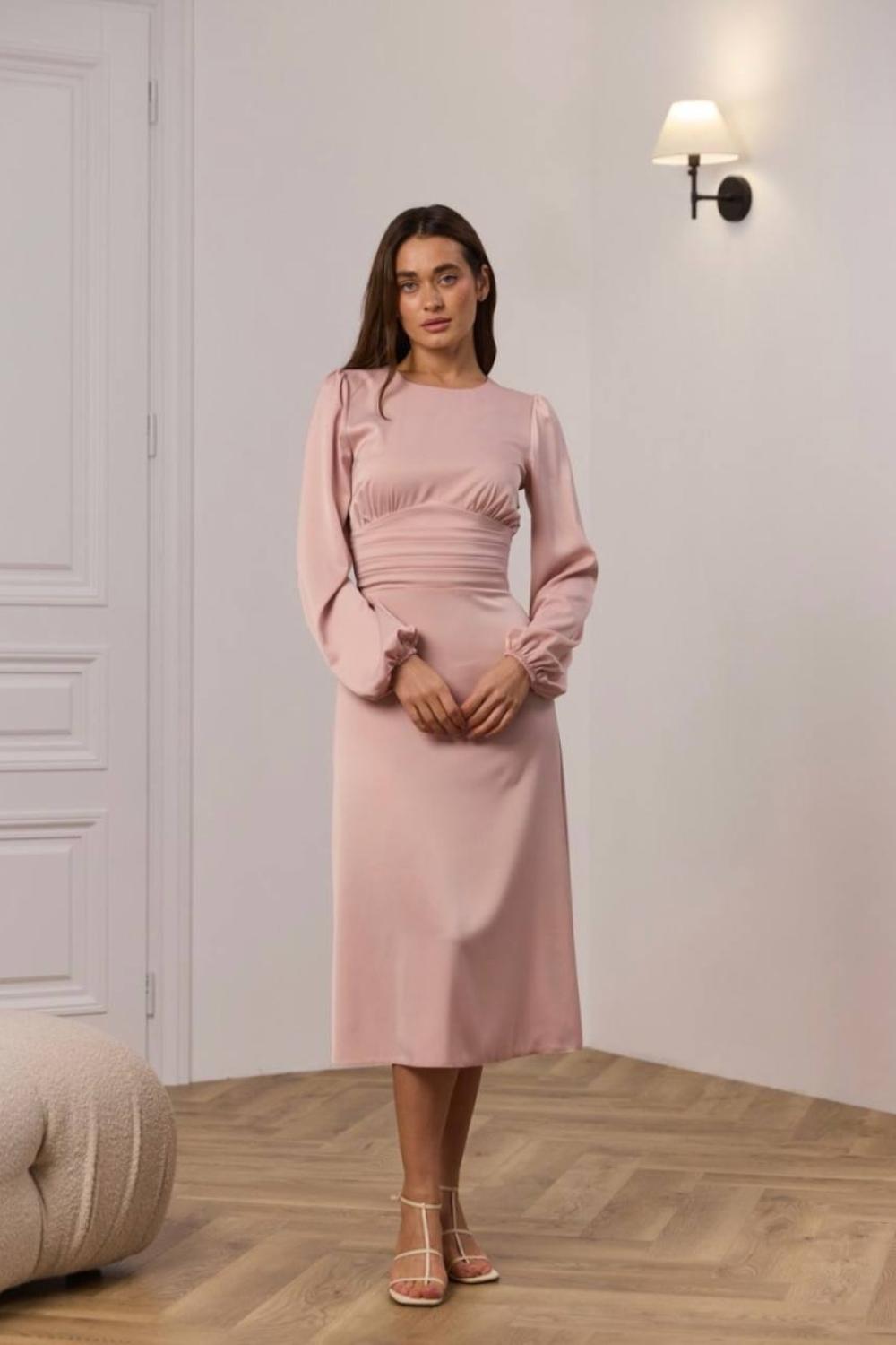 Elegant powder-colored midi-length dress.