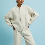 Cream-colored sweater with a zipper