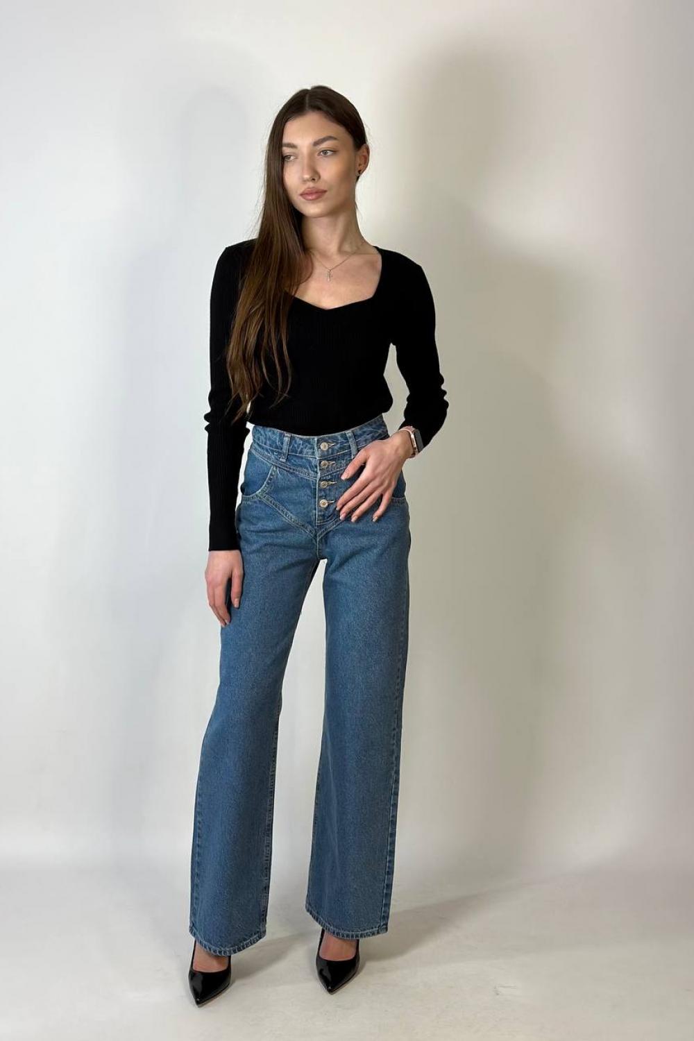 Women's jeans are straight with a curly coquette of blue color