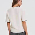 White jumper with piping