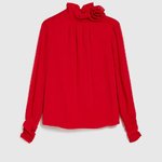 Red blouse with a rose