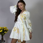 Women's white embroidered dress with gold embroidered spikes