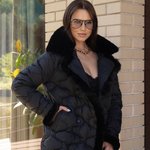 Jacket in black color with artificial fur