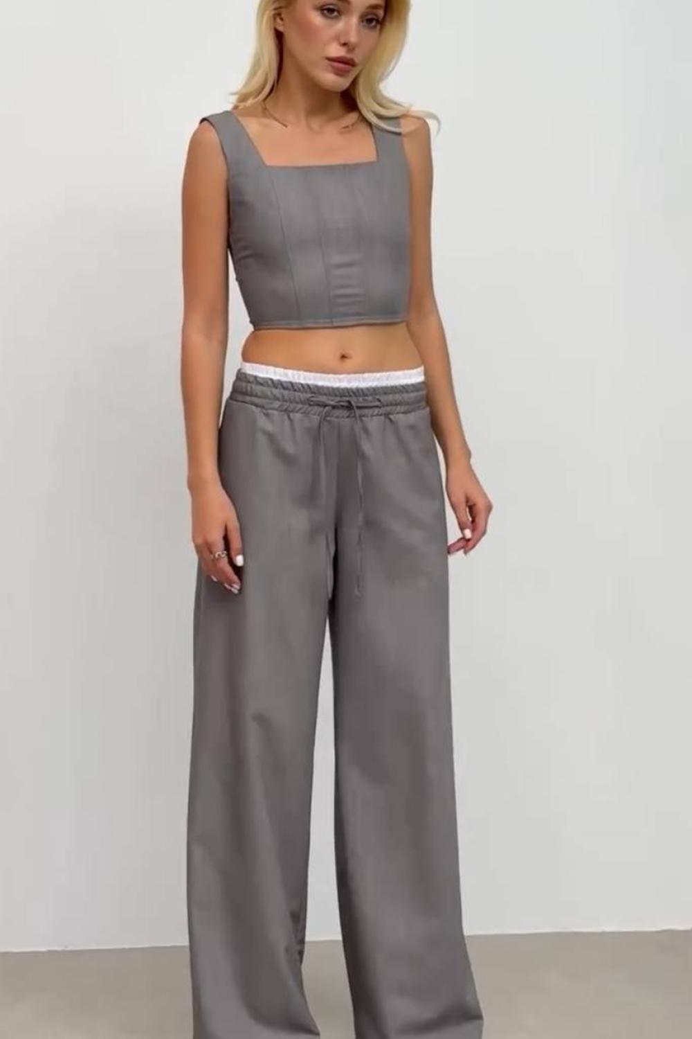 Gray trousers with an elastic waistband with a double belt