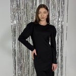 Black knitted dress tailored to the figure. France
