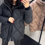 Jacket in black color with artificial fur